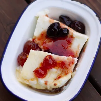 Malabi milk pudding with red syrup