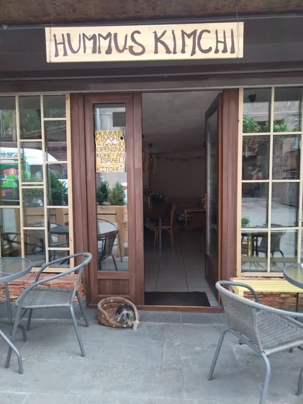 The entrance under the hand-painted Hummus Kimchi sign
